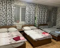Кровать в общем 4-местном номере Гостевой дом Гостевой дом Твой Oтель Томск без звезд