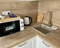 Трехместный номер с балконом Апартаменты Апартаменты Be Home Краснодар без звезд Забронируй по своей цене!