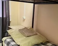 Кровать в общем 4-местном номере для мужчин Хостел Хостел 4 Комнаты Сургут без звезд